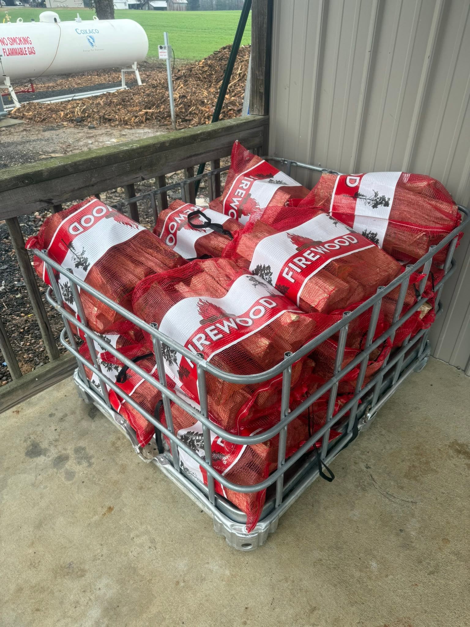 Bagged firewood bundles stacked at Wallburg Mulch Worx in High Point NC