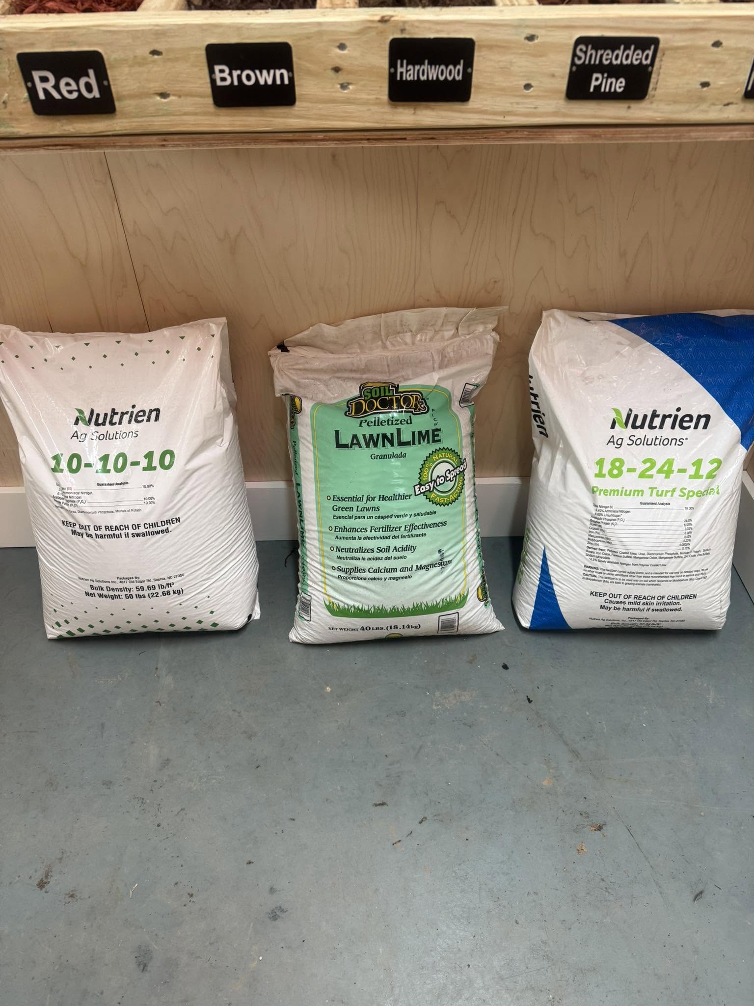 Bags of 10-10-10 fertilizer and lime at Wallburg Mulch Worx in High Point NC