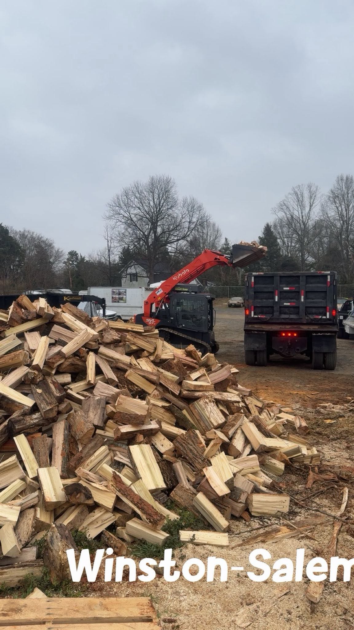 Firewood being loaded for delivery at Wallburg Mulch Worx in High Point NC