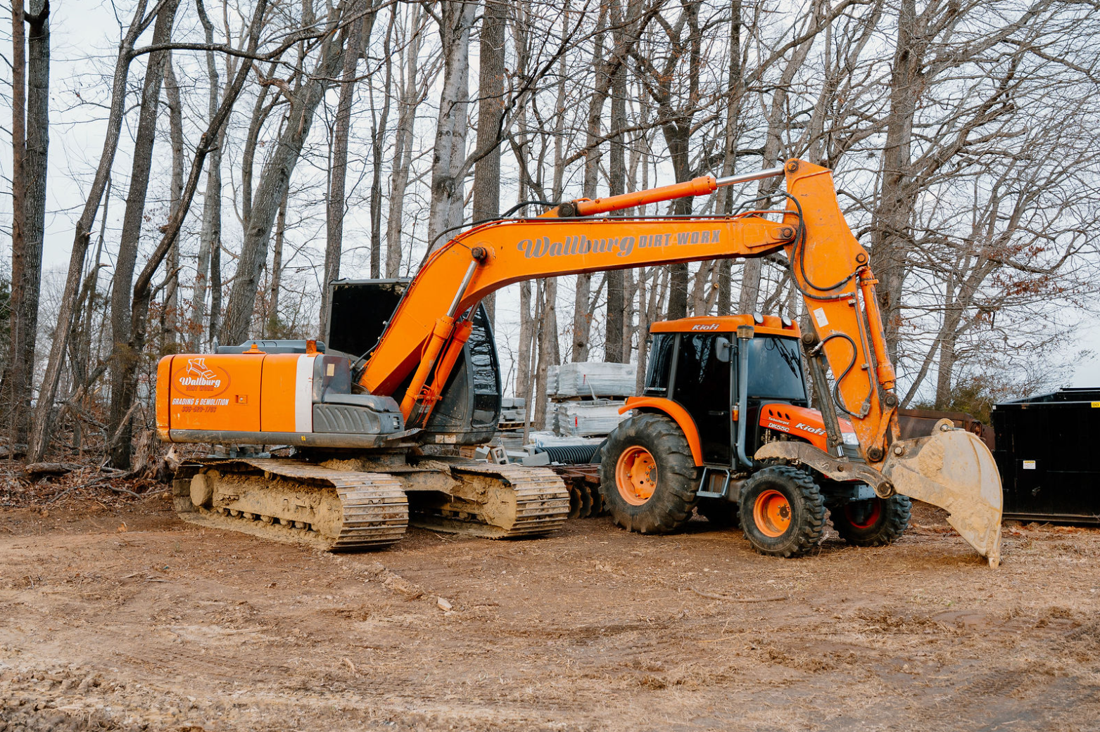 Excavator and tractor working at the Wallburg Mulch Worx yard in High Point NC