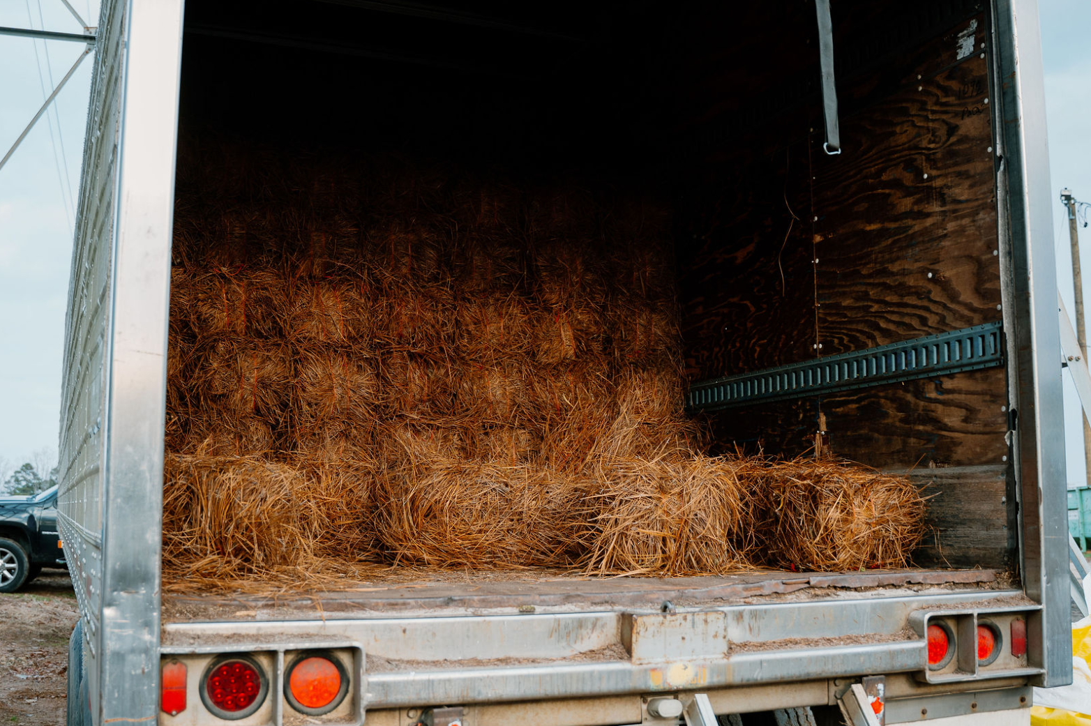 Pine needle bales loaded in a delivery truck at Wallburg Mulch Worx in High Point NC